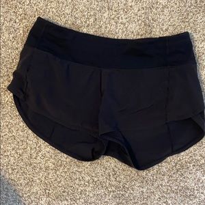 worn black lululemon shorts